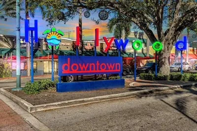 a sign that reads down town in front of a building at Hollywood 2 Bdrm New Furnished Beach Vacation LB2 in Hollywood
