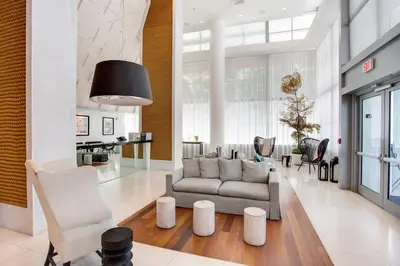 a living room with a couch and chairs at Monte Carlo by Miami Vacations in Miami Beach