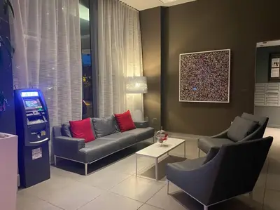 a living room with a couch and two chairs at Elegant Miami Beach Apt Ocean Views, Full Kitchen & Style in Hallandale Beach