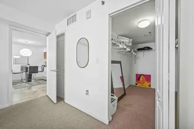a hallway with a white door with a mirror and a room at PH Luxury 1 Bed 1 Bath • Brickell • Ocean Views in Miami