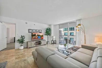 a living room with a couch and a tv at PH Luxury 1 Bed 1 Bath • Brickell • Ocean Views in Miami