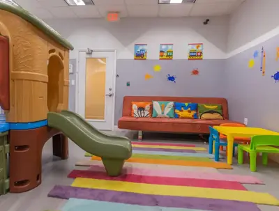 a childrens play room with a couch and a slide at Deluxe 1 Bedroom Apartment • Brickell • Ocean View in Miami