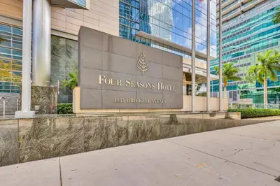 a sign for the four seasons hotel in front of a building at Amazing private studio in Four Seasons Residences Brickell! in Miami