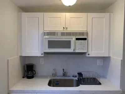 a kitchen with a sink and a microwave at Private Hollywood APT Near Beach Airport & Casino in Hollywood