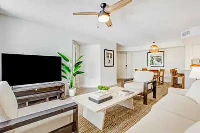a living room with a large flat screen tv at Tucker at Palm Trace Landings Fort Lauderdale in Davie