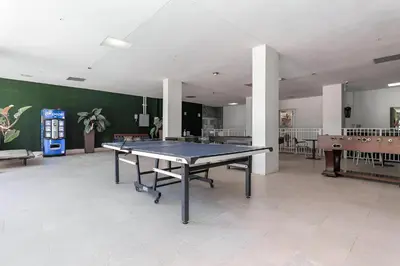 a large room with a ping pong table in it at Zen Vacation Rentals Modern Penthouse Across Ocean in Miami Beach