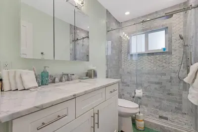 a bathroom with a sink and a toilet and a shower at Heated Pool I Soundproof Home I Firepit I 630Mbps in Hollywood