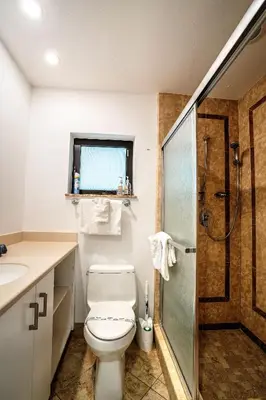a bathroom with a toilet and a shower at A 1bedroom Las Olas on the water in Fort Lauderdale
