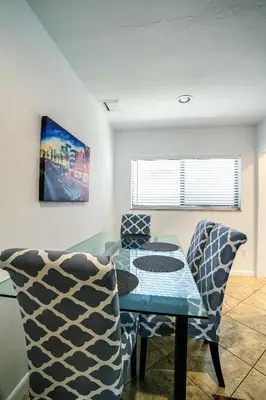 a dining room with a table and two chairs at A 1bedroom Las Olas on the water in Fort Lauderdale