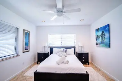 a bedroom with a bed and a ceiling fan at A 1bedroom Las Olas on the water in Fort Lauderdale