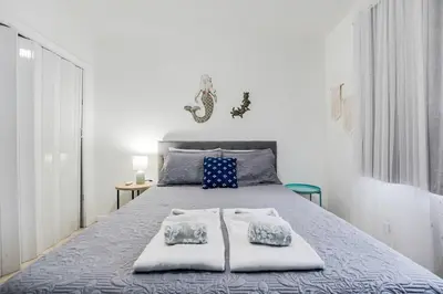 a bedroom with a bed with two towels on it at Bright and Airy Miami 1BR Apt Near Brickell in Miami