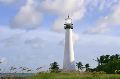 a lighthouse on a hill with a cloudy sky at 1BR Little Havana Apt stepts to Calle 8 in Miami