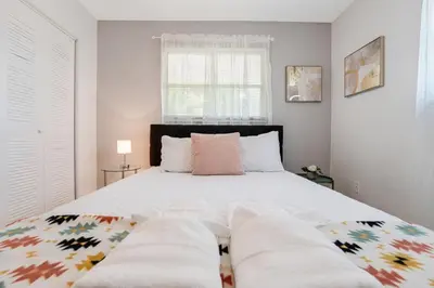 a bedroom with a large bed with two pillows at Trendy 2BR Little Havana Apartment in Miami