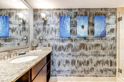 a bathroom with a sink and a mirror at Modern Ft Lauderdale Condo about 7 Mi to Airport! in Fort Lauderdale