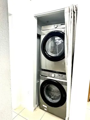 two washing machines are in a room at Beautiful 1BD 1BTH at Midblock FREE PARKING in Miami