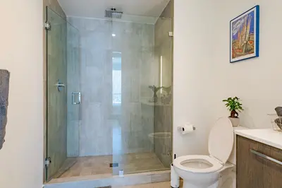 a bathroom with a shower with a toilet at Luxurious 2-Bed Apartment with Breathtaking Bay views!! in Miami