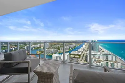 a balcony with a view of the ocean at Beautiful Beachfront Penthouse in Hollywood