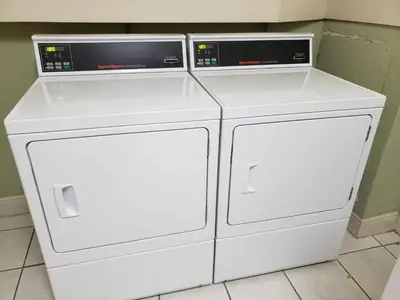 two white washing machines sitting next to each other at The Tides apartment Go Holiday Home 5th floor in Hollywood