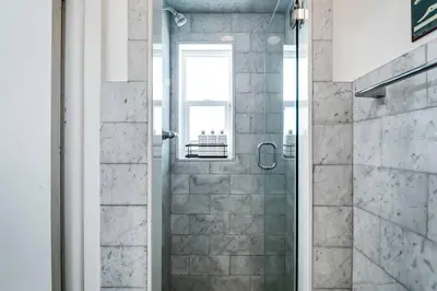 a shower with a glass door in a bathroom at *Victoria Park Pool Home- close to beach/Las Olas* in Fort Lauderdale