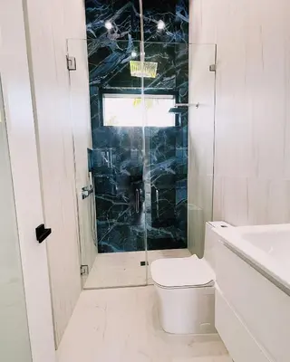 a bathroom with a shower and a toilet and a sink at Men only clothing option guesthouse near Wilton Manors in Fort Lauderdale