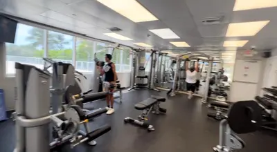 a gym with several people standing in the gym at Lovely beaches ocean & city view in Miami Beach