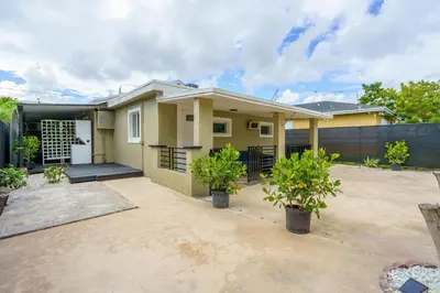 a house with a driveway in front of it at 2 BD Home w/ Private Parking, Private Yard & W/D in Miami
