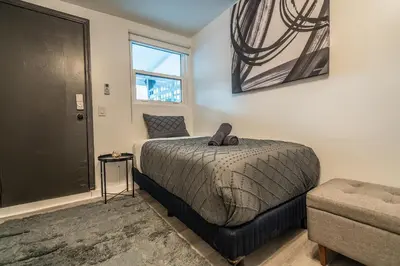 a bedroom with a bed and a window at Cozy Studio w/gated parking in Miami