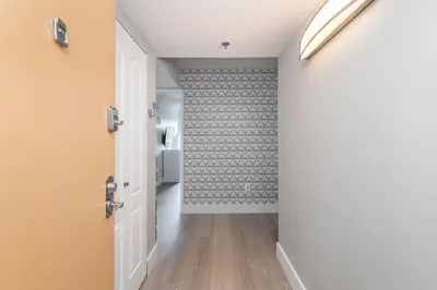 a hallway with a door and a room with a wall at Spacious 3 Bedroom Condo in Aventura in Aventura