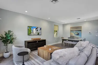 a living room with a couch and a piano at Victoria Park Overlook in Fort Lauderdale