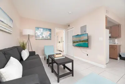 a living room with a couch and a table at The Retreat 2 - Wilton Manors in Fort Lauderdale