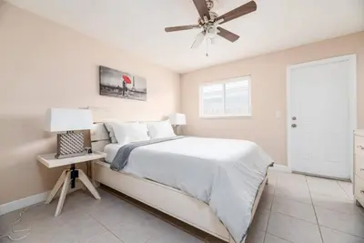 a bedroom with a bed and a ceiling fan at The Retreat 2 - Wilton Manors in Fort Lauderdale
