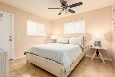 a bedroom with a bed and a ceiling fan at The Retreat 1 - Wilton Manors in Fort Lauderdale