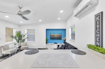 a living room with white walls and a ceiling fan at Two Bedroom Hollywood Beach Vacation Sc01 in Hollywood