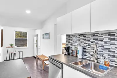 a kitchen with a sink and a counter top at Hollywood 2 Bdrm Beach Vacation & Hard Rock Sc02 in Hollywood