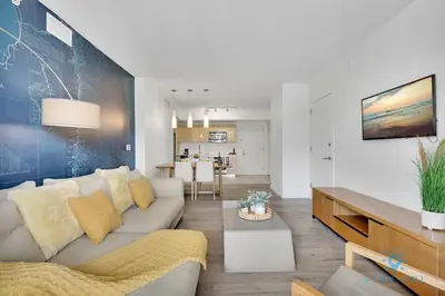 a living room with a couch and a table at Modern Resort - Gym - Pool - Near Beach in Hallandale Beach