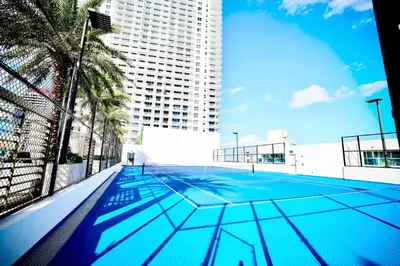 an empty swimming pool in a city with a tall building at Diamond In The Sky in Hollywood