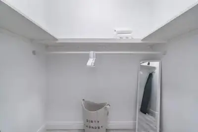 a room with a white ceiling and a trash can at New Townhome near Wilton/Las Olas/Beach in Fort Lauderdale