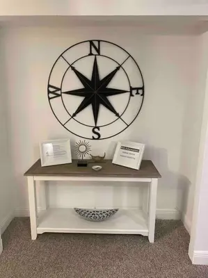 a large clock on a wall above a table at Ocean reserve 702 - STR 2315 in Miami Beach