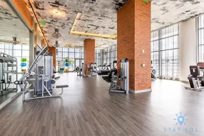 a gym with treadmills and cardio equipment in a building at HighFloor with Stunning Views, Pools, Near Beach in Hollywood