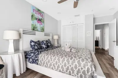 a bedroom with a bed with a stuffed animal on it at Casa Flamingo Intracoastal Front with Heated Pool in Fort Lauderdale
