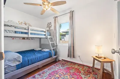 a bedroom with a bunk bed and a window at Wileys Paradise Three Bedroom Two Bath plus Office and Heated Pool in Hollywood