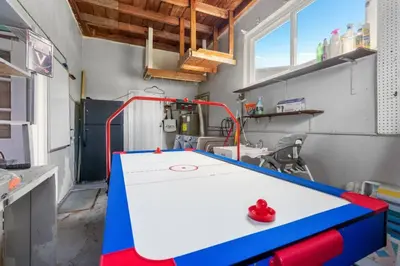 a ping pong table in a room at Wileys Paradise Three Bedroom Two Bath plus Office and Heated Pool in Hollywood