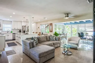 a living room with a couch and a table at Beautiful Comfy Home With Private Hot Tub Close To Beach home in Fort Lauderdale