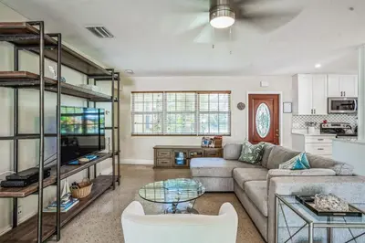 a living room with a couch and a table at Beautiful Comfy Home With Private Hot Tub Close To Beach home in Fort Lauderdale
