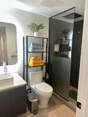 a bathroom with a toilet and a sink and a shower at Exceptional Studio with King Bed and Queen Sofa-bed in Miami