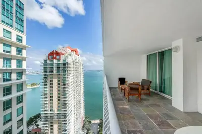 a balcony with a view of the ocean and buildings at Elegant 1BR APT w balcony and stunning bay view in Miami