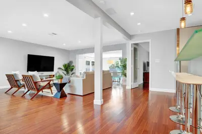 a living room with a couch and a table at Modern 4BR Villa with Pool - Outdoor amenities - WFH in Fort Lauderdale