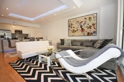 a living room with a couch and a table at LUXURY CONDO LOCATED iN THE HEART OF MIAMI in Miami