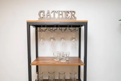 a wine rack with glasses and a sign that reads cellar at 2Bed 2 Bath Airbnb Friendly building with Pool, Hot Tub, and Gym in Miami