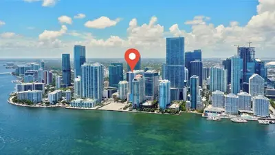 an aerial view of a city with a red marker at 2 Bedroom, 2 Bathroom plus Den Brickell Condo Pool, Hot Tub, and Gym in Miami